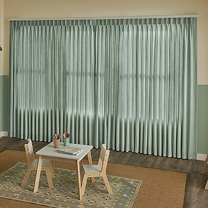 Sage green draperies in playroom