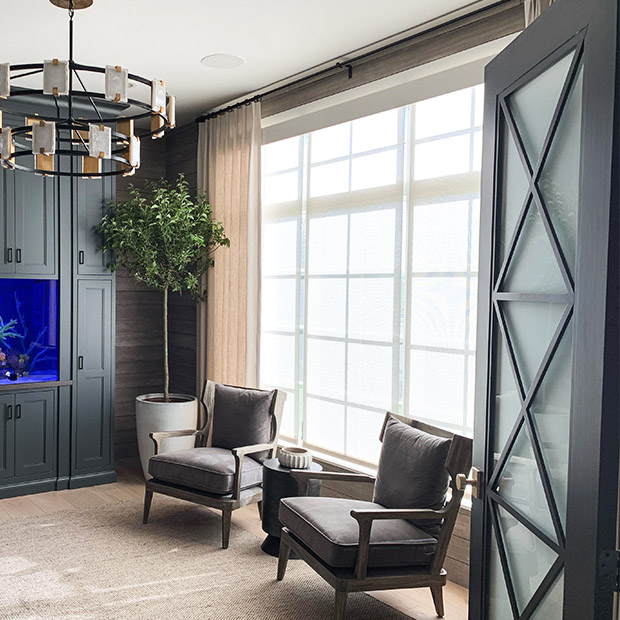 White motorized shades in a large living room window